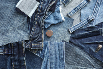 Many patches of old jeans as background, top view