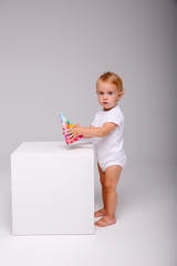 toddler wearing birthday cap on isolated background