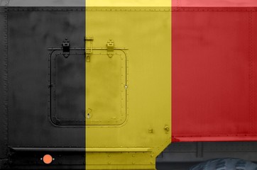 Belgium flag depicted on side part of military armored truck closeup. Army forces conceptual...
