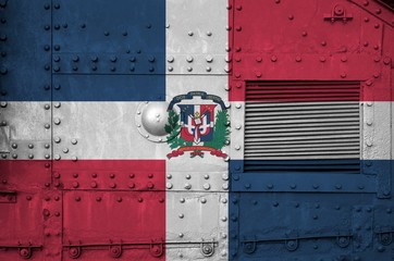 Dominican Republic flag depicted on side part of military armored tank closeup. Army forces...