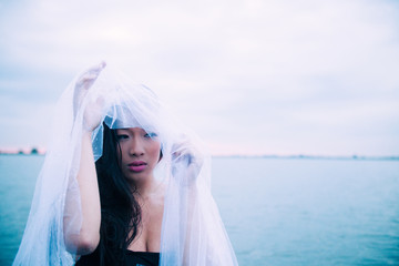 Asian model in the water enjoying a wellness spa.