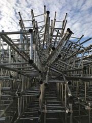 The aluminum pipes were demolished by workers at the construction site.