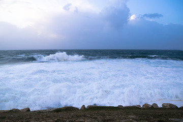 Ocean waves crashing on the rocky coastline