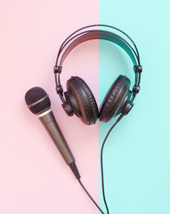 Microphone and headphone on a pastel background