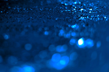 blue glitter sparkle isolated on black background. color 2020