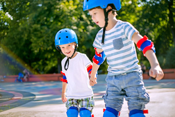 Cute siblings roller skating together