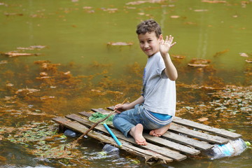 The boy floating on a raft