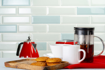 Tea served on a wooden kitchen table