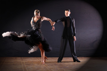 dancers in ballroom isolated on black background