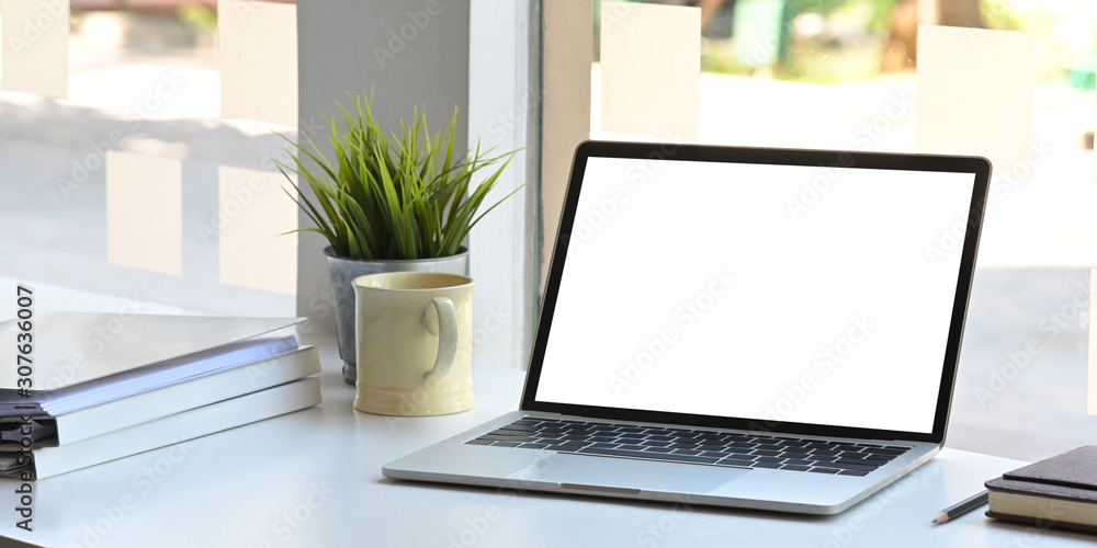 Poster workspace desk with mockup laptop with blank screen and coffee mug, notebook with document paper in 