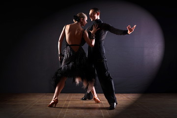 Dancers in ballroom isolated on black background - obrazy, fototapety, plakaty