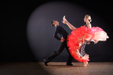 dancers in ballroom isolated on black background