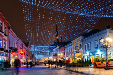 Novi Sad, Serbia - December 04, 2019: Novosadski Winter Fest. Zmaj Jovina street in Novi Sad decorated for New Year and winter spells. - obrazy, fototapety, plakaty
