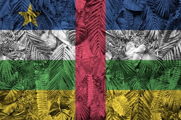Central African Republic flag depicted on many leafs of monstera palm trees. Trendy fashionable...