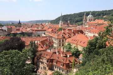 Fototapeta premium Classic Prague - aerial view to old roof buildings and street , Czech Republic