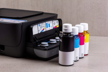 inkjet four-color printer with continuous ink supply and ink bottles for refilling