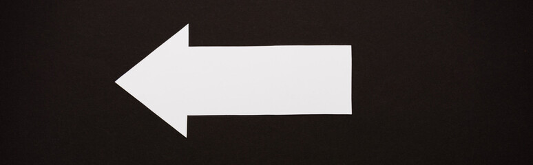 panoramic shot of directional arrow isolated on black
