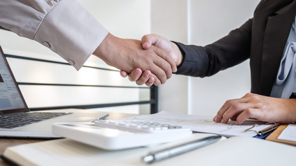 Business woman shaking hands after conversation, Finishing up a collaboration discussing of partner cooperation in investment marketing project and successful contract agreement to become teamwork