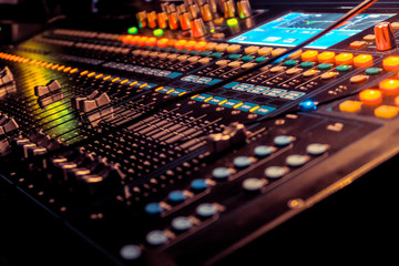 Closeup of an audio mixing control panel