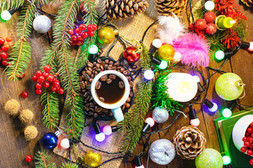 cup of coffee on the background of Christmas decorations.