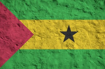 Sao Tome and Principe flag depicted in bright paint colors on old relief plastering wall. Textured...