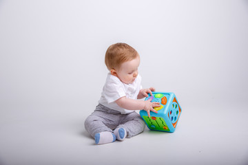 toddler with toy isolated on white background