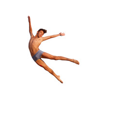 Athletic teenager in swimming trunks in a jump on a white background