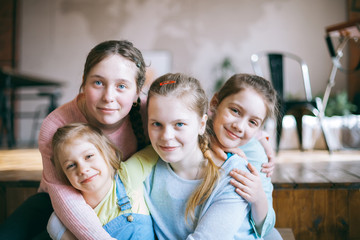 Four hugging  sisters