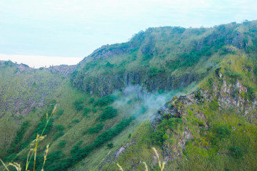 Obraz premium Beautiful view of Batur Lake and Batur Mountain at Kintamani, Bangli, Bali with Forest and Blue Sky