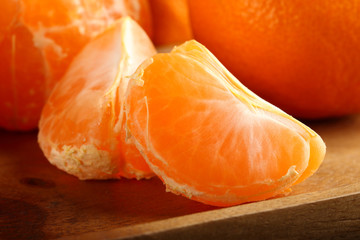 Peeled slices of juicy, ripe tangerine, close-up. Macro.