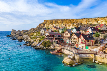 Fototapeta na wymiar Aerial view of famous tourist attraction Popeye village. Sunny day, blue sea. Mellieha city. Malta island