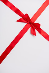satin ribbon with red decorative bow isolated on white