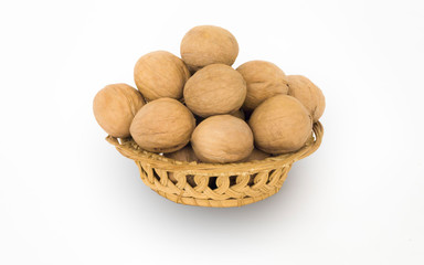 Walnuts in a basket on a white background