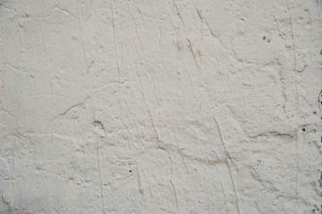 Abstract background. Rough texture, white plastered wall with irregularities. Structure, background.