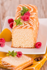 Lemon sponge cake with pomegranate.	
