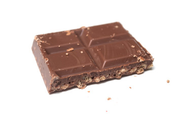 closeup of milk puffed rice chocolate blocks on white background