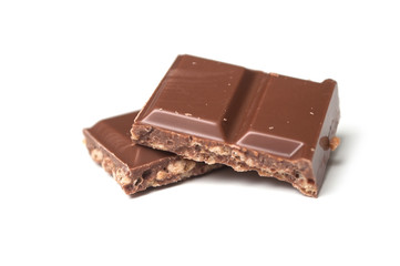 closeup of milk puffed rice chocolate blocks on white background