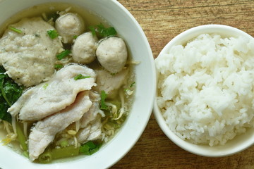boiled soft slice pork and ball in clear soup on bowl eat with plain rice