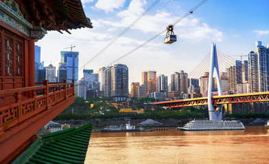cityscape and skyline of downtown near water of chongqing at night