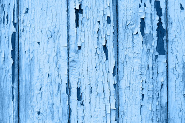 Wooden fence with cracks and texture of old paint. Color of the year 2020 concept.