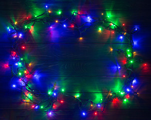 Christmas background with lights and free text space. Christmas lights. Glowing colorful Christmas lights . New Year. Garland.