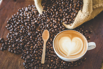 coffee latte with coffee beans  on dark background, top view