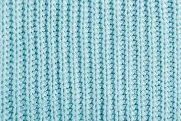 Fototapeta premium Blue texture of a large knit sweater. Knitted scarf background, winter cozy textile background