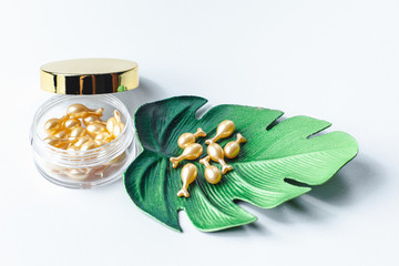 Emulsion for skin health. Face and eye cream. New technologies in cosmetics. Cream on bamboo leaf background