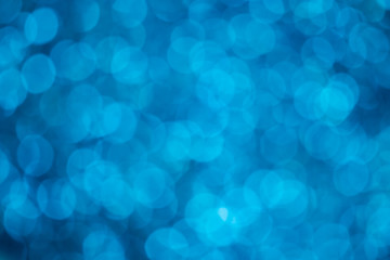 abstract blur or defocused lights bokeh on blue background