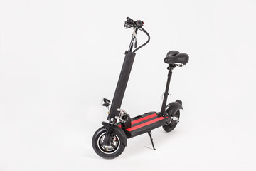 Black electric kick scooter with seat on white background