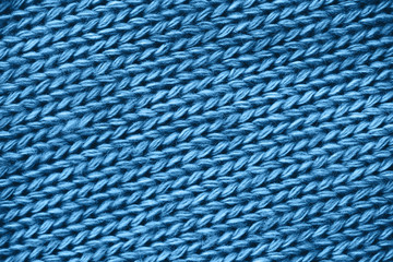 Blue knitting sweater pattern close up.