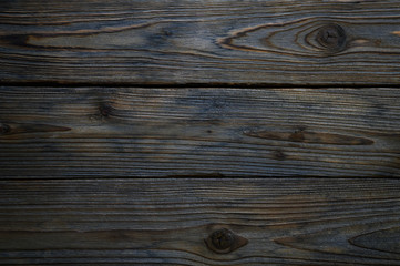 Fototapeta premium background of old shabby burned brown gray wooden boards