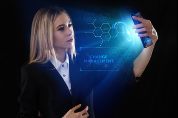 Business, Technology, Internet and network concept. Young businessman working on a virtual screen of the future and sees the inscription: Change management