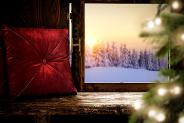 Wooden window sill of free space and christmas time.Xmas tree with lights and decmber landscape.